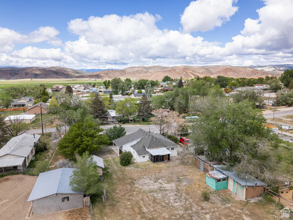 Aerial perspective of suburban area featuring a mountain backdrop