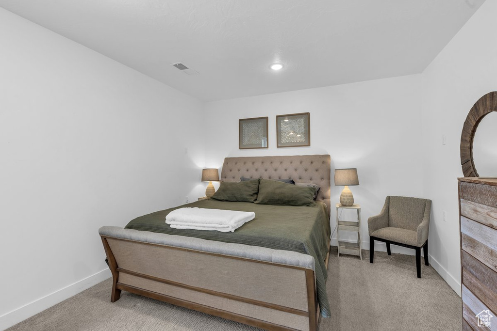 Carpeted bedroom with baseboards and recessed lighting