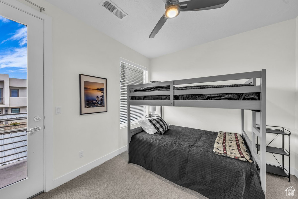 Bedroom featuring carpet floors, baseboards, and a ceiling fan