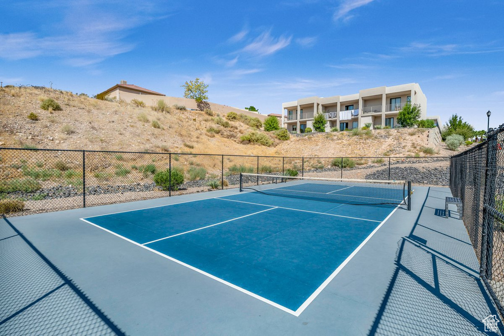 View of tennis court with fence