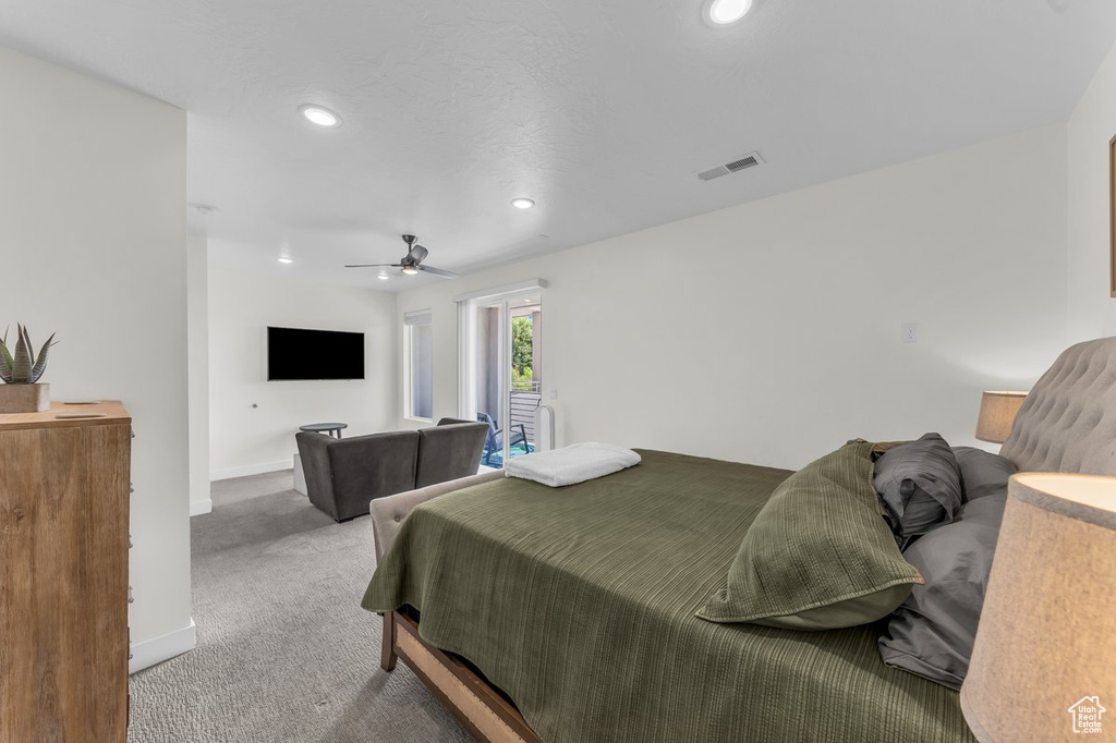 Carpeted bedroom featuring recessed lighting, baseboards, and a ceiling fan