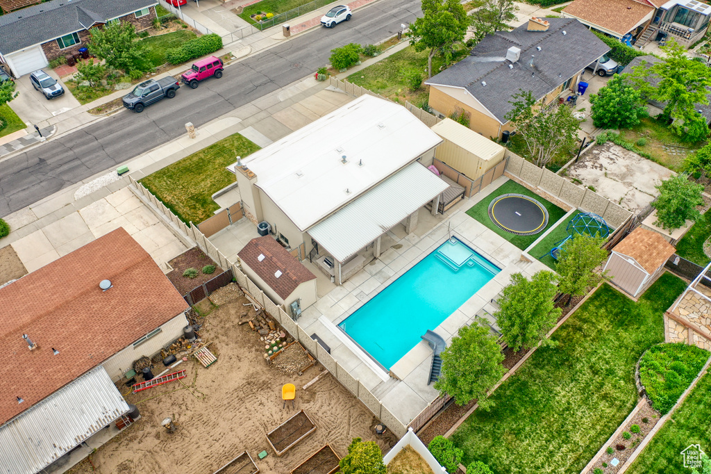 Aerial perspective of suburban area featuring a pool area