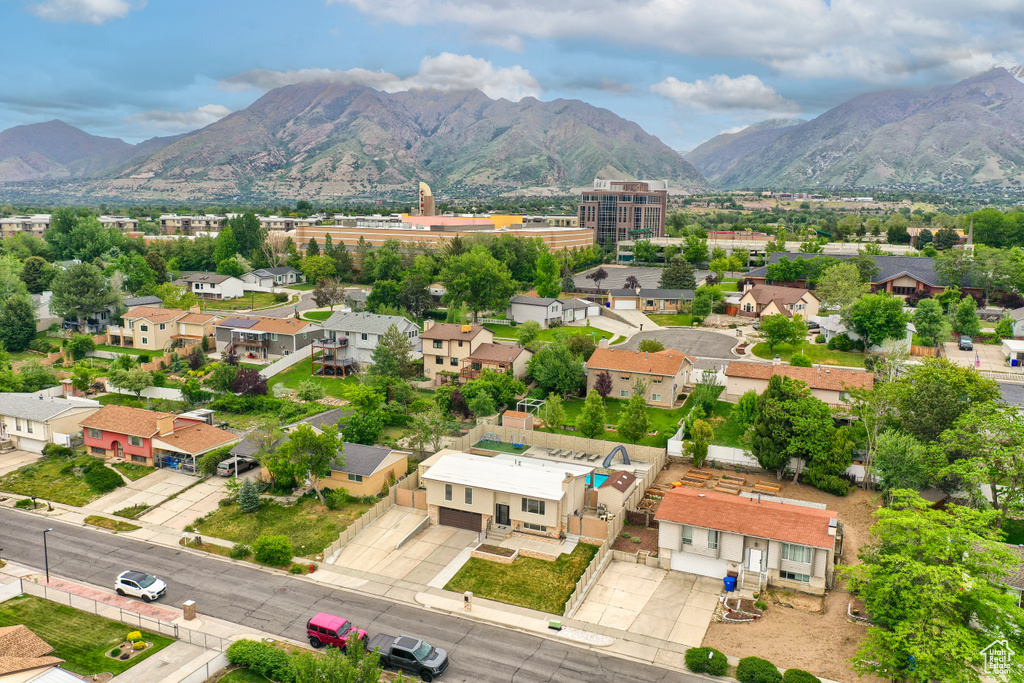 Aerial view of residential area with a mountainous background
