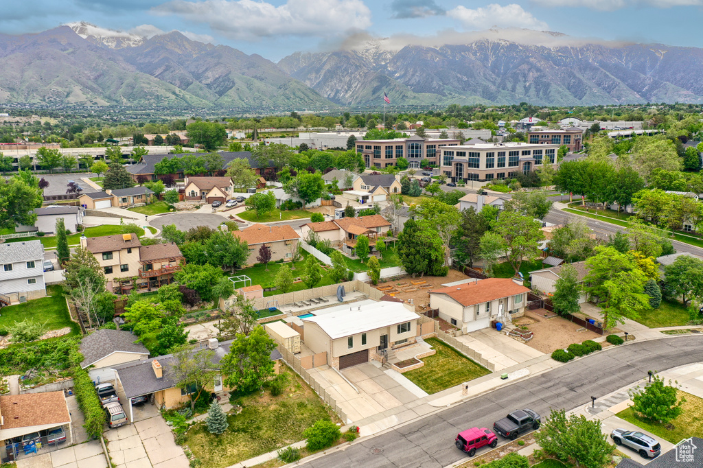 Aerial view of residential area with a mountainous background