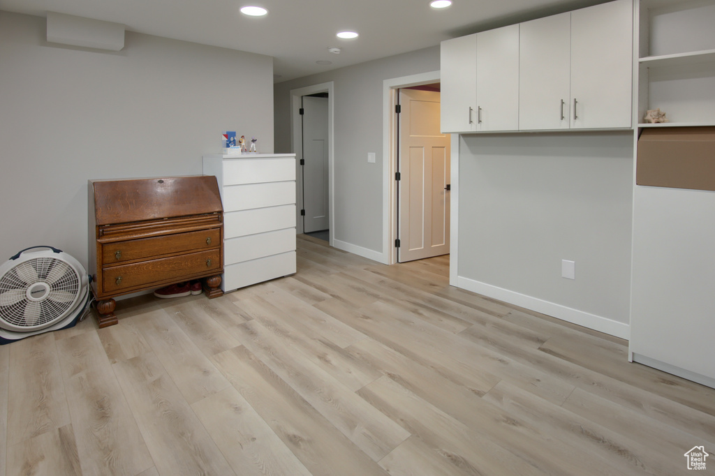 Bedroom featuring recessed lighting, light wood-style floors, and baseboards