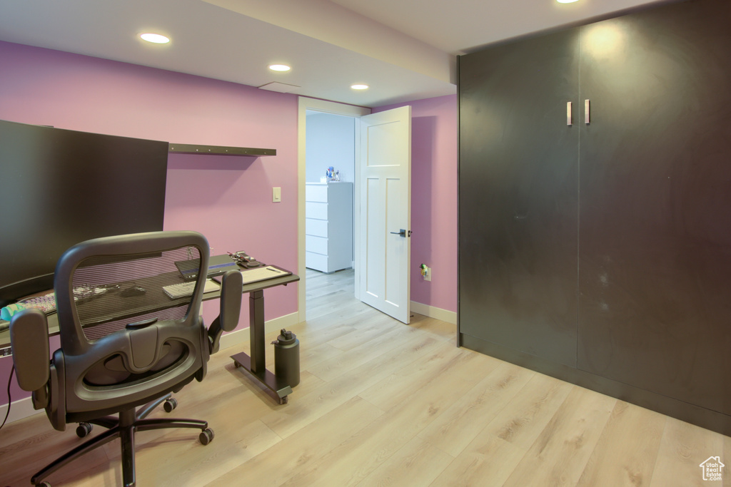 Workout room with wood finished floors, recessed lighting, and baseboards
