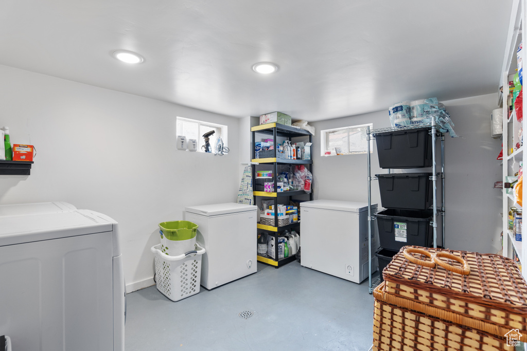 Laundry room featuring washing machine and dryer and recessed lighting