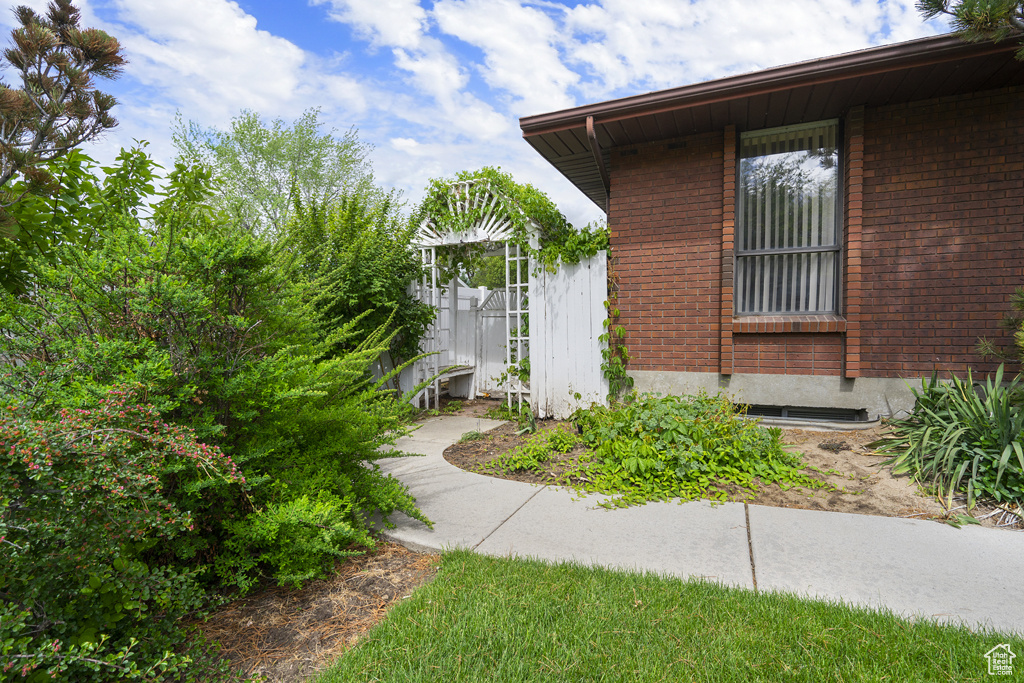 View of property exterior featuring brick siding