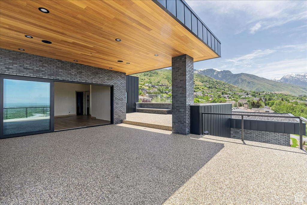 View of patio / terrace featuring a mountain view and a balcony