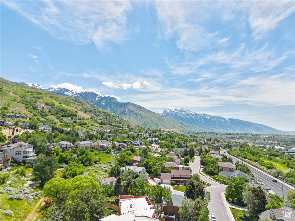 Aerial view of residential area featuring a mountain backdrop