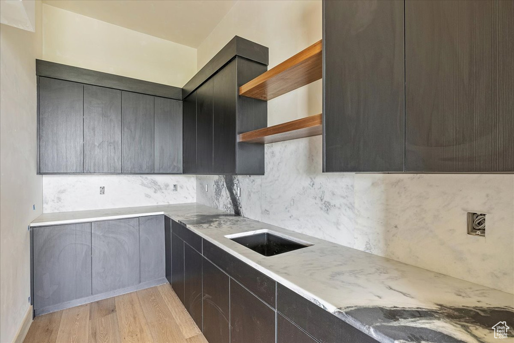 Kitchen with open shelves, modern cabinets, and backsplash