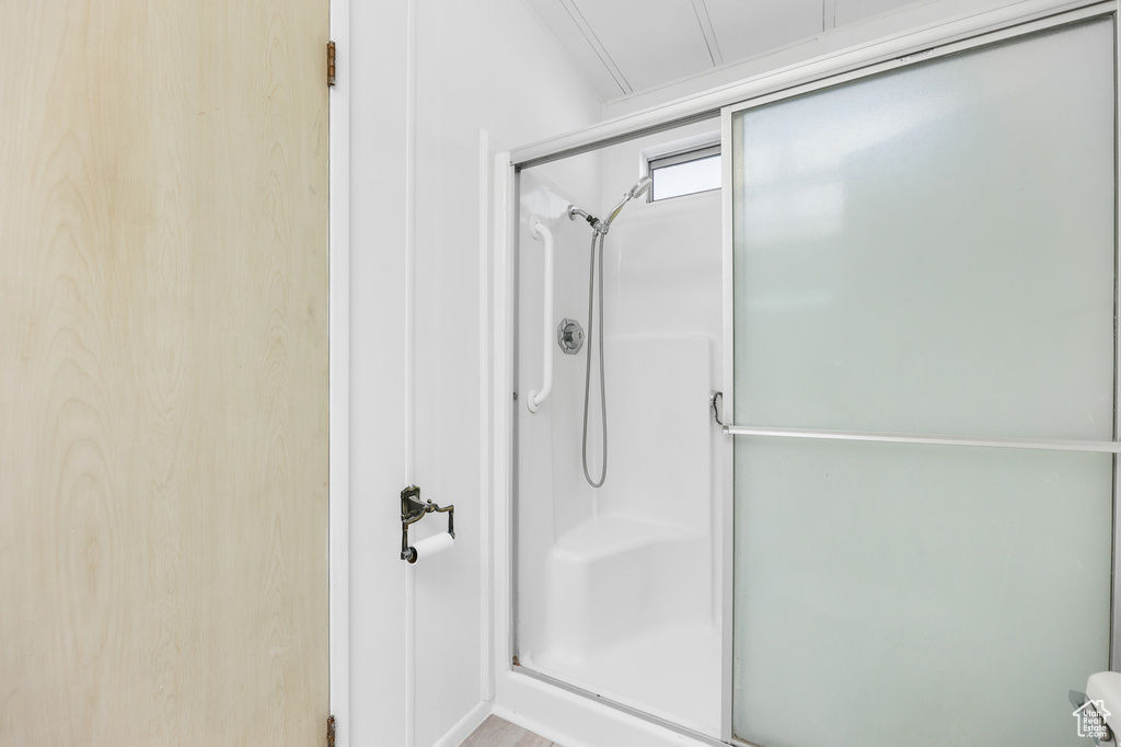Full bathroom with a shower with shower door