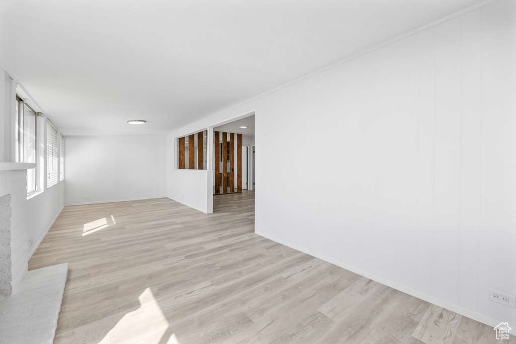 Unfurnished room with light wood-type flooring