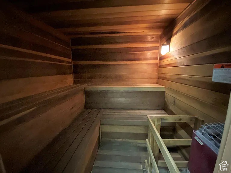 Sauna / steam room with wood ceiling and wooden walls