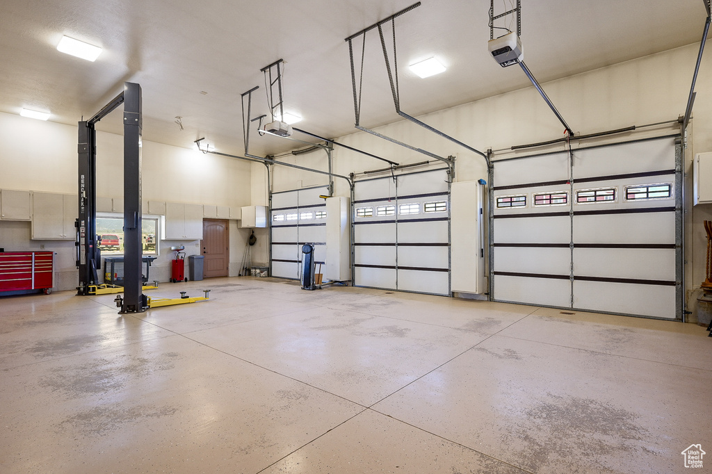 Garage featuring a garage door opener