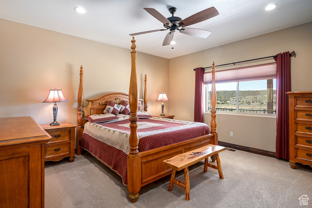 Bedroom with light carpet, recessed lighting, baseboards, and a ceiling fan
