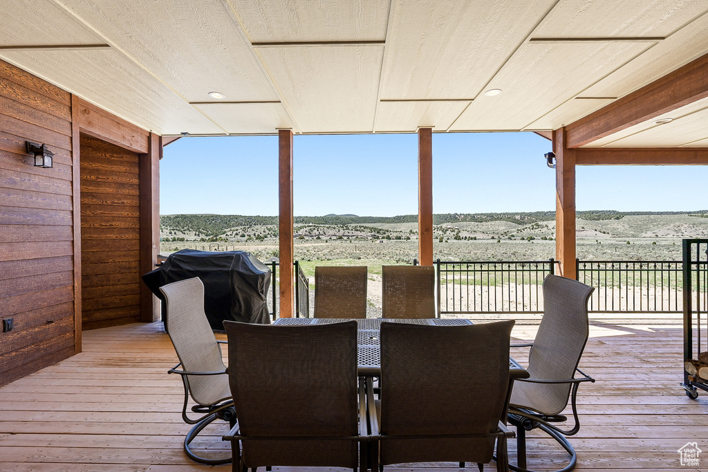 Wooden deck with grilling area and a mountain view
