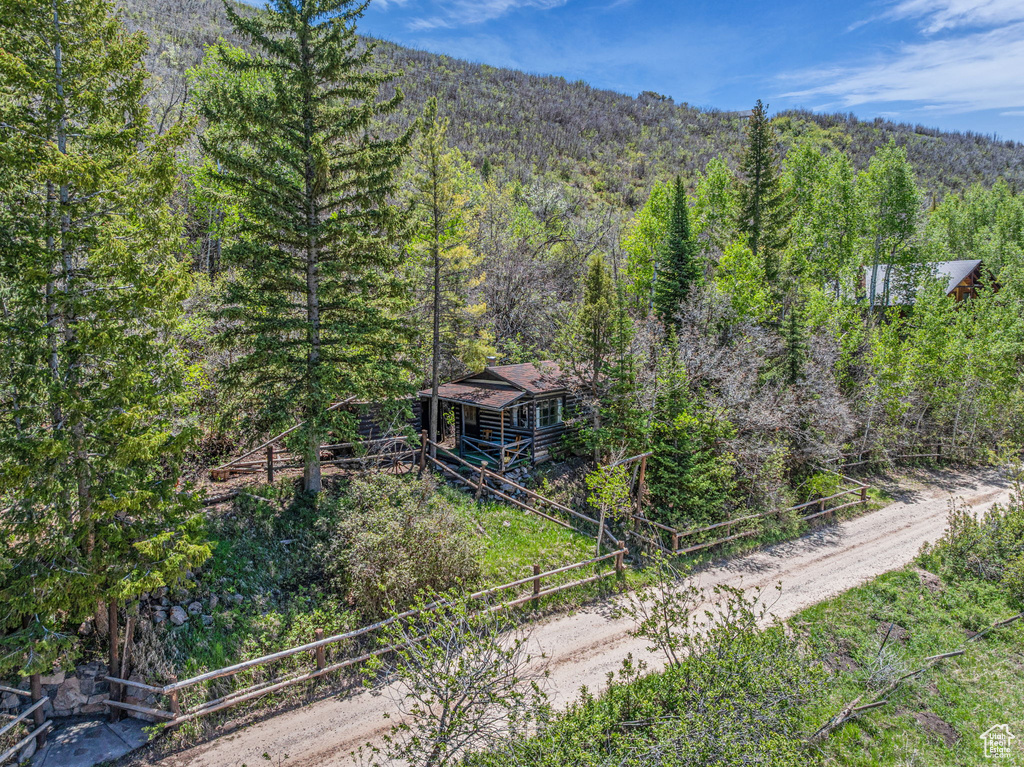 View of subject property featuring a heavily wooded area
