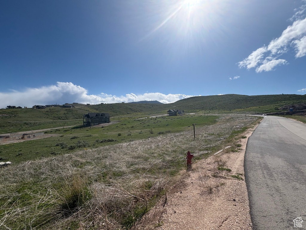 View of mountain background featuring rural landscape