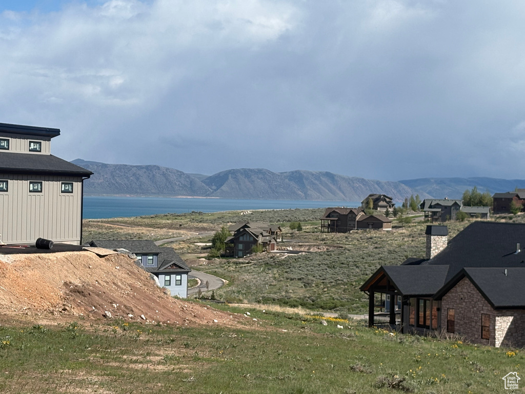 View of mountain backdrop featuring a nearby body of water