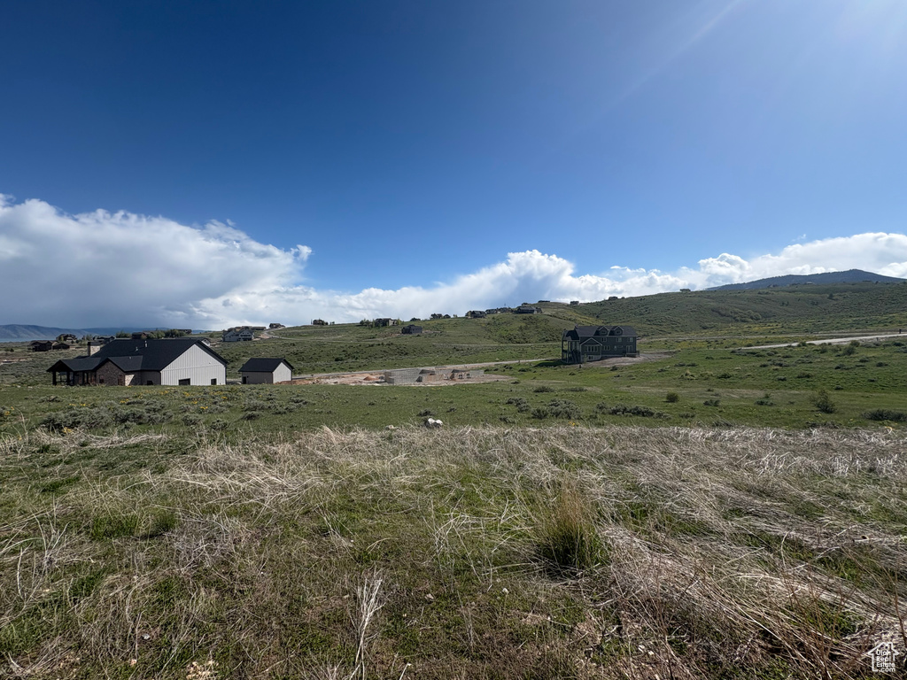 View of mountain backdrop featuring rural landscape
