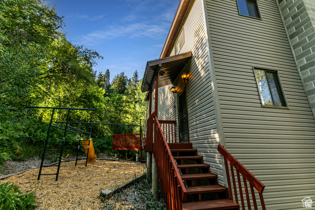 View of property exterior with a playground