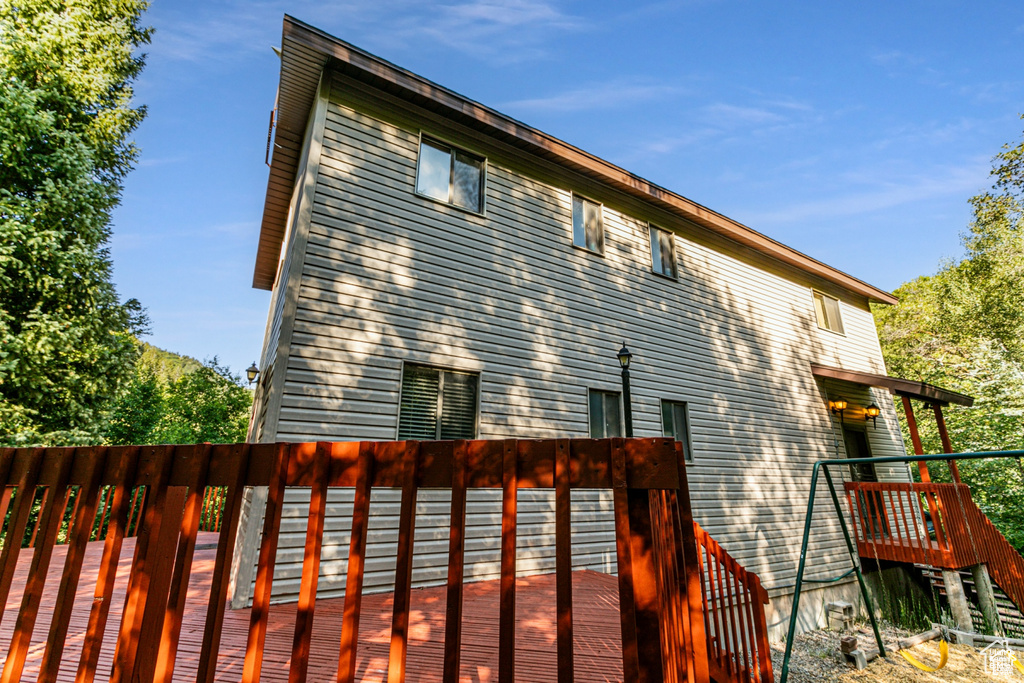 Rear view of property featuring a deck