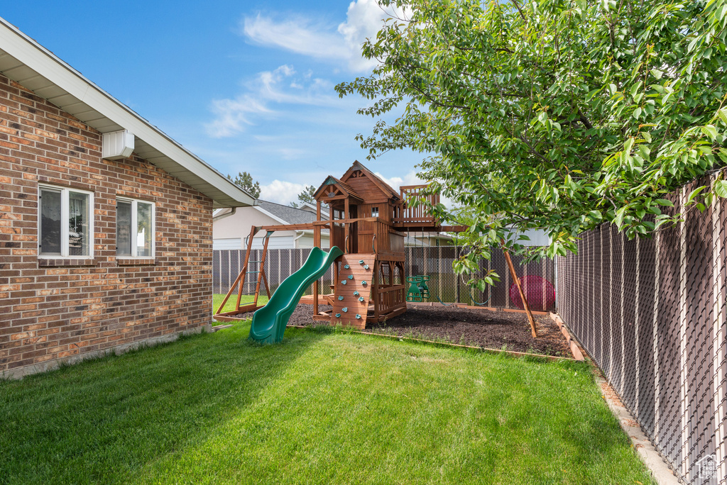 View of yard featuring a playground
