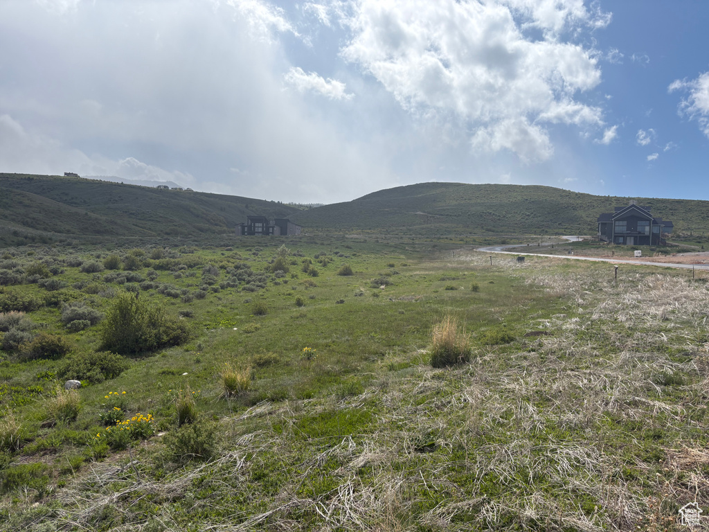 View of mountain background featuring rural landscape