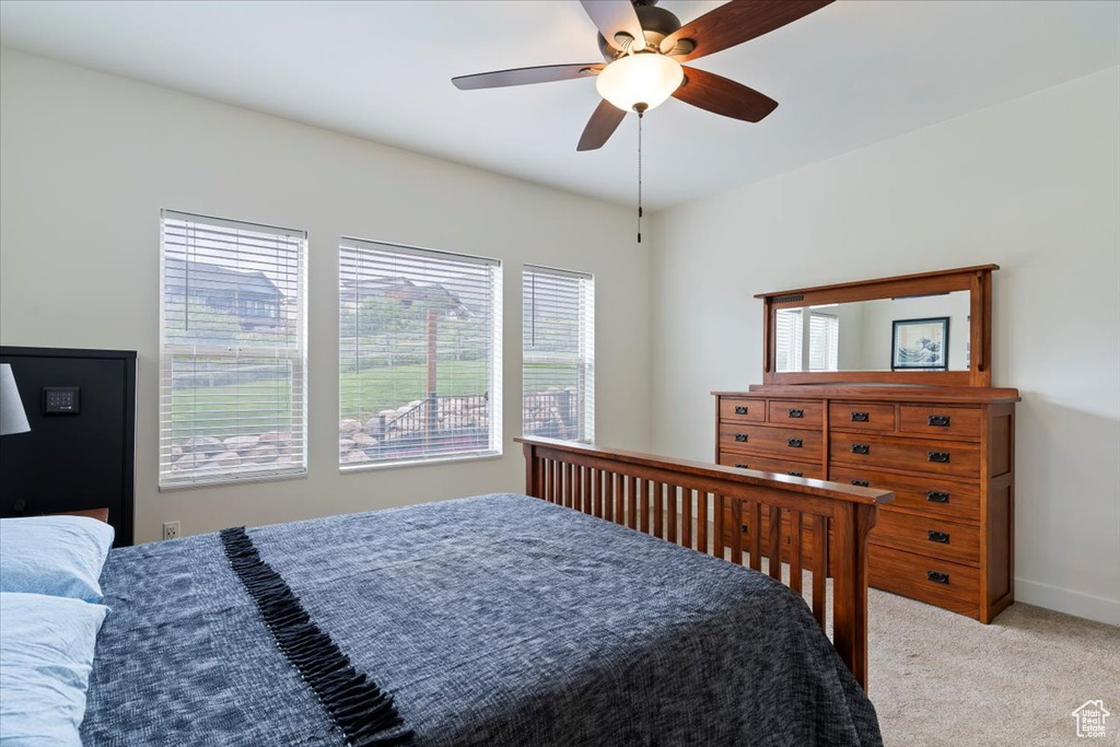 Bedroom featuring carpet and a ceiling fan