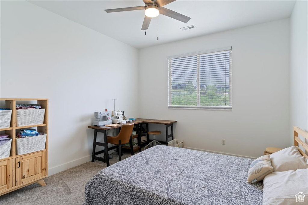 Bedroom featuring carpet flooring, baseboards, and a ceiling fan