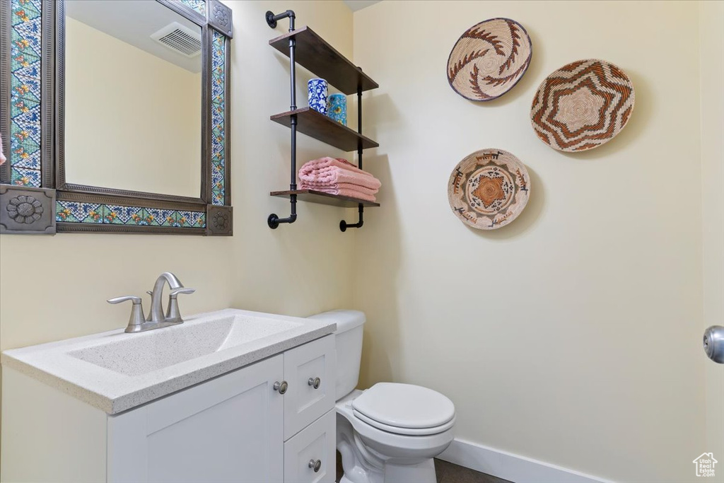 Bathroom featuring toilet and vanity
