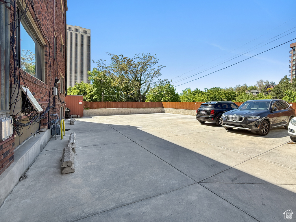 View of patio featuring fence