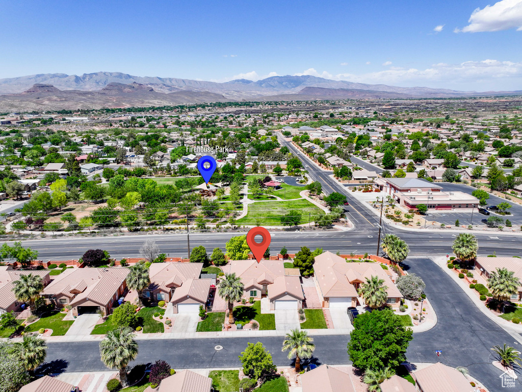 Aerial view of residential area featuring a mountain backdrop