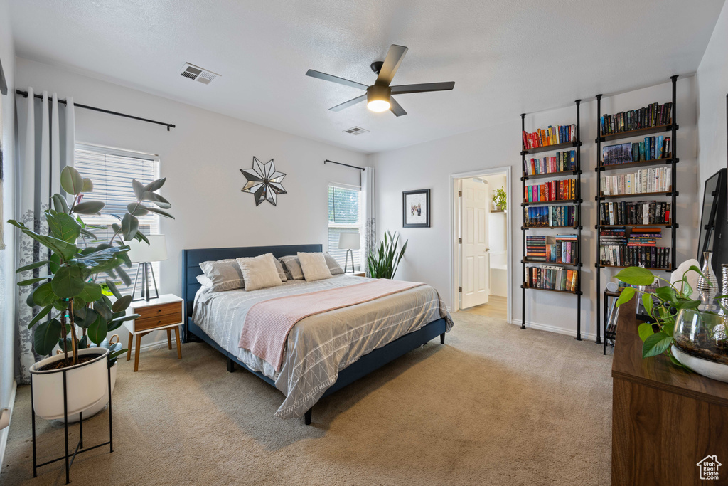 Bedroom featuring light colored carpet and baseboards