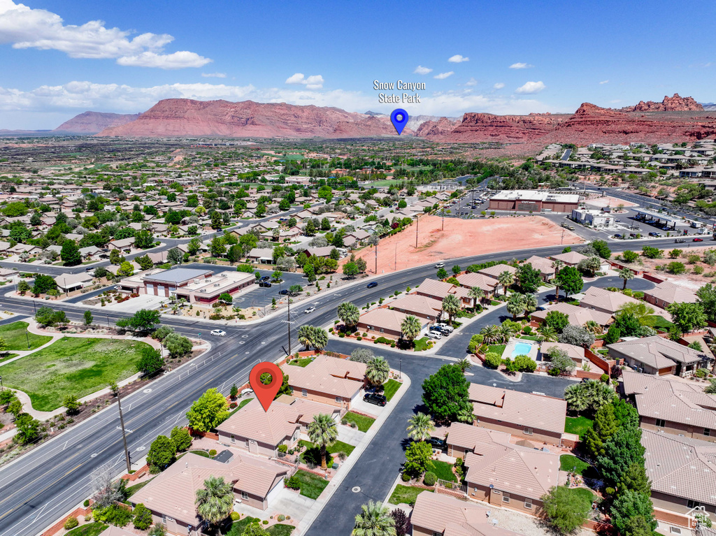 Aerial view of residential area featuring a mountain backdrop