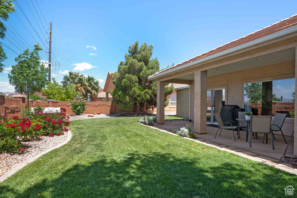View of yard with a patio area
