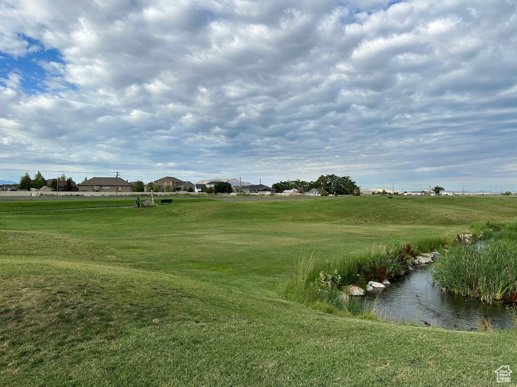 View of community featuring a lawn