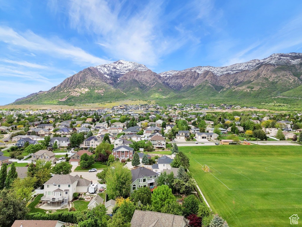 View of mountain backdrop featuring nearby suburban area