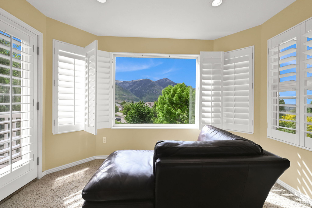 Sitting room with baseboards, carpet floors, recessed lighting, and a mountain view
