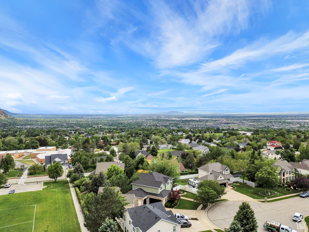 Aerial perspective of suburban area with a mountainous background