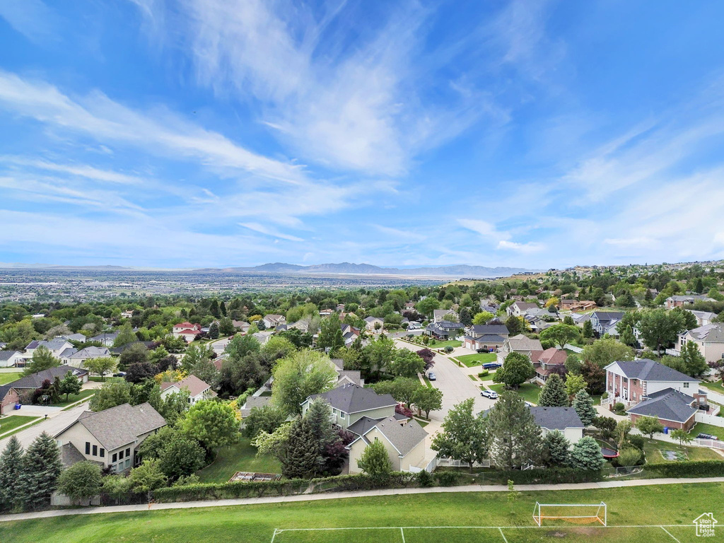 Aerial perspective of suburban area featuring a mountainous background