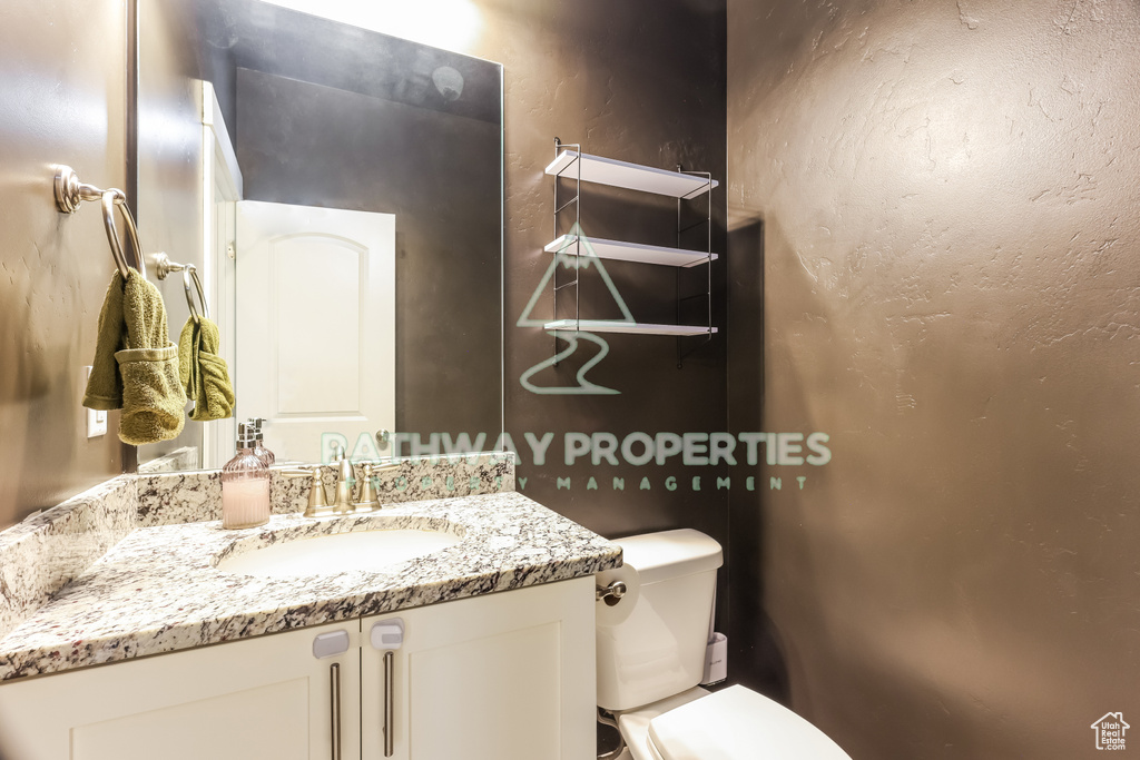 Bathroom with toilet and vanity