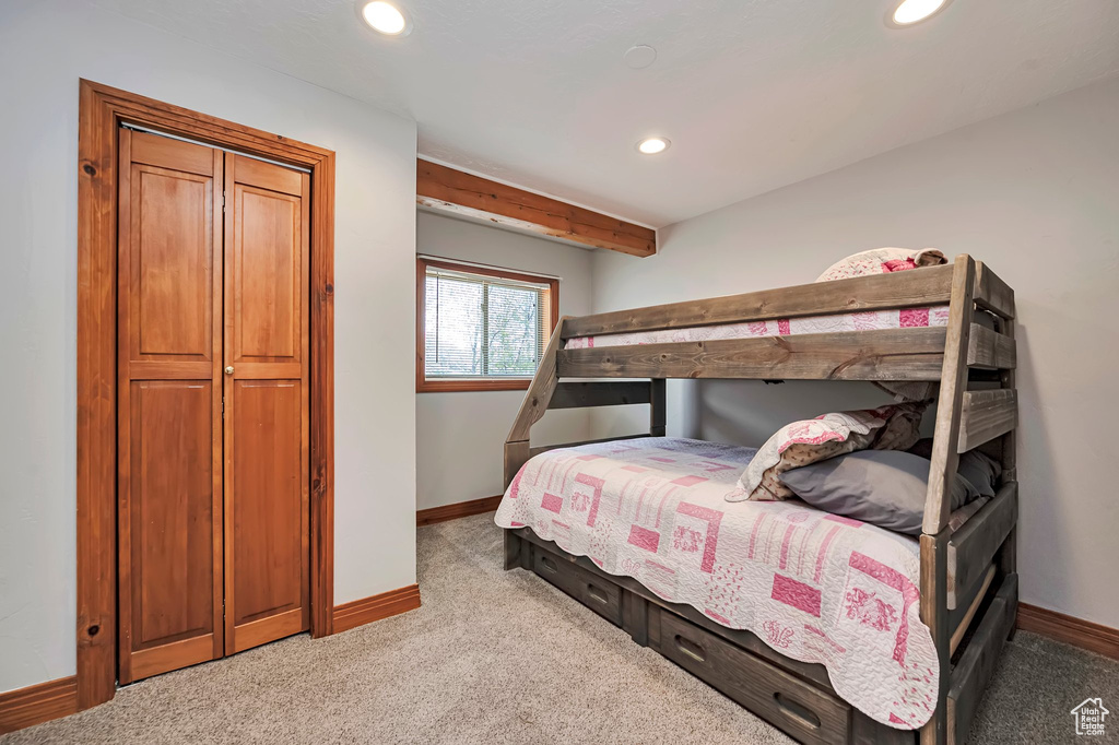 Bedroom with baseboards, recessed lighting, and carpet flooring