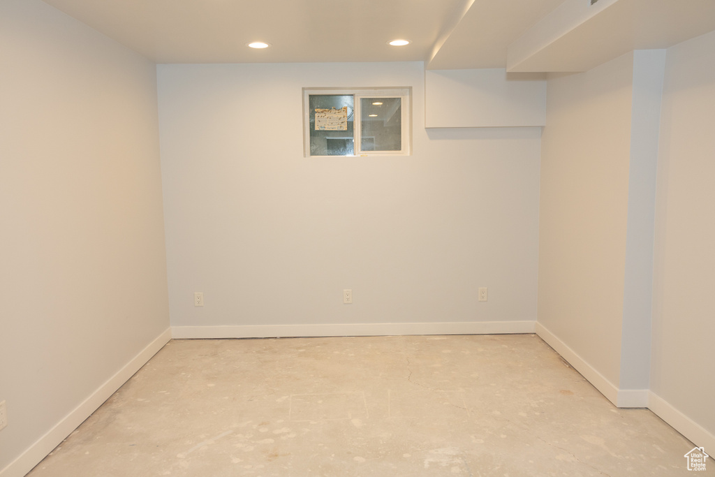 Finished basement with recessed lighting and baseboards
