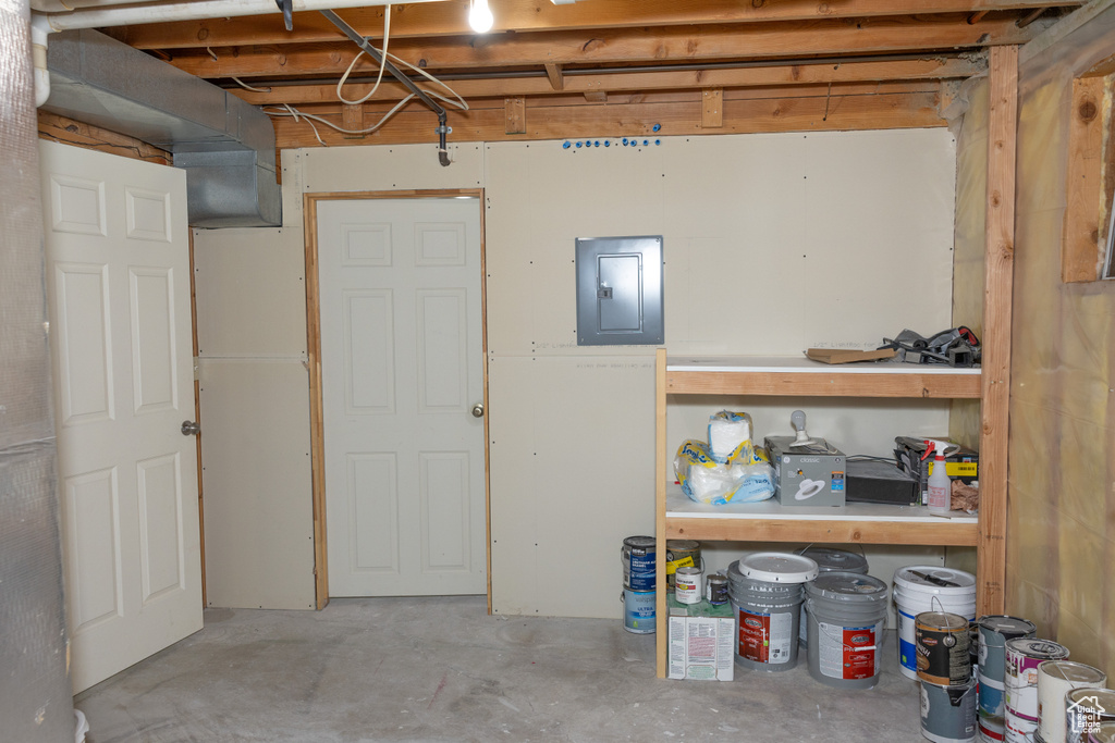 Unfinished below grade area featuring electric panel