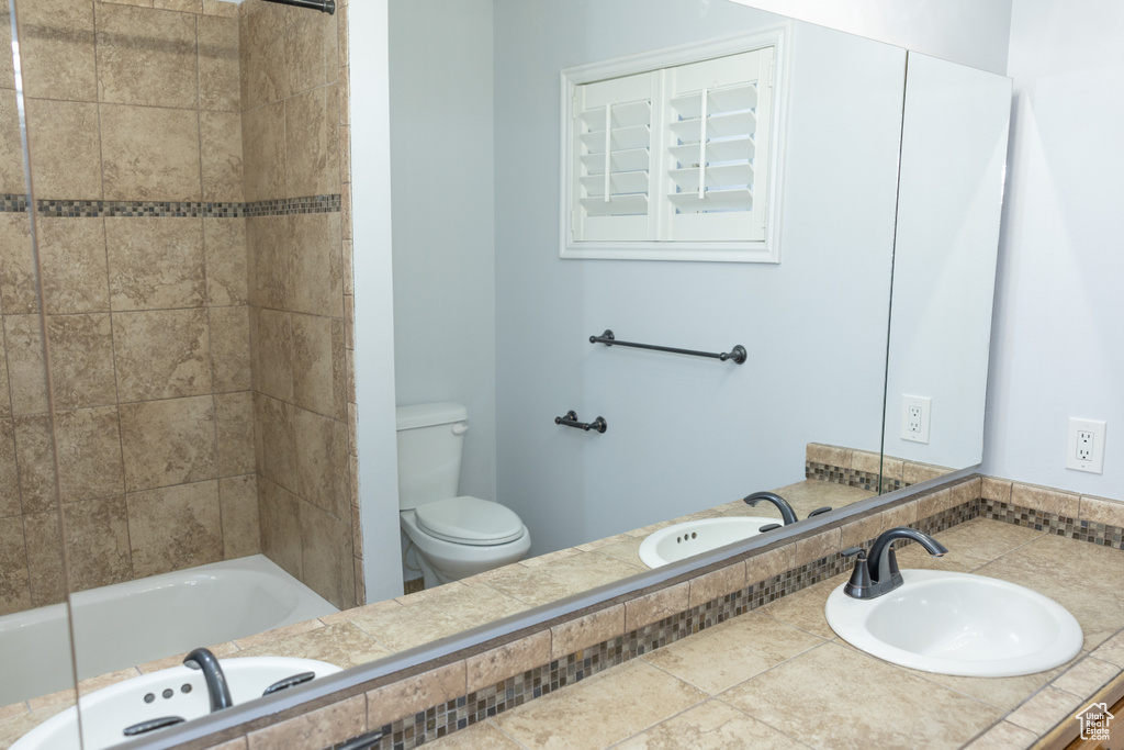Full bath with toilet and vanity
