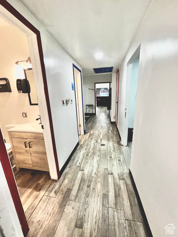 Corridor with wood-type flooring