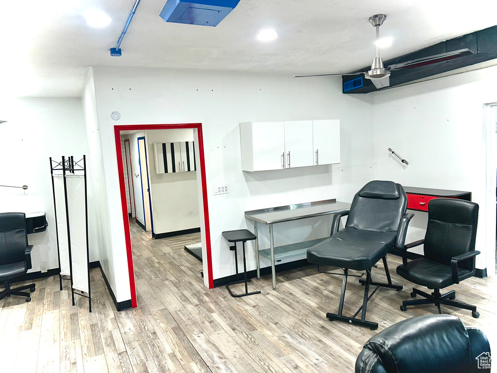Office area featuring light wood-type flooring and baseboards