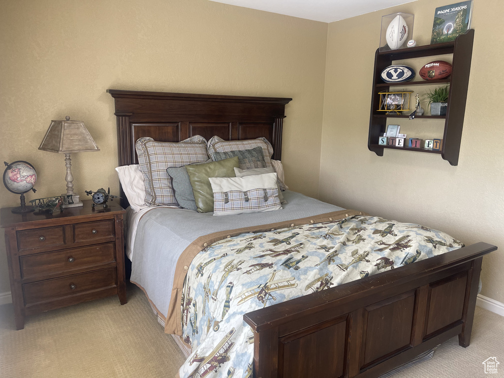 Bedroom with light carpet